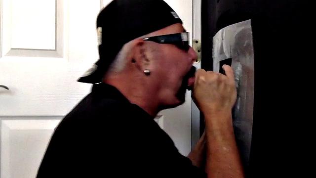 Senior gloryhole amateur blows BF's dick through hole