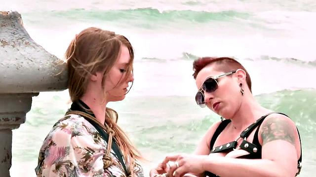 Public slut deepthroats cock in front of voyeurs