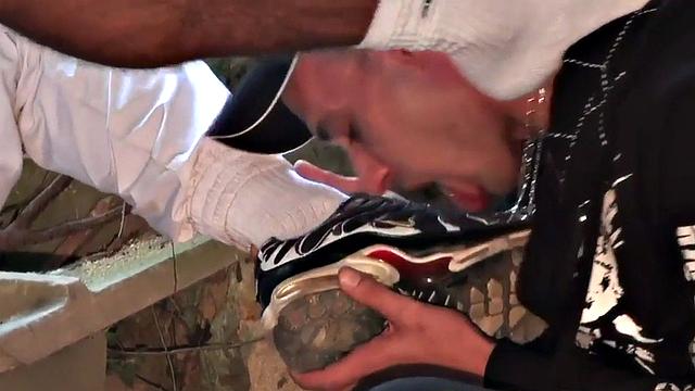 Sneakers and foot fetish guy sucks cock in abandoned place