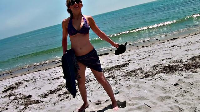 Blonde beach babe gets her tight pussy pounded by her neighbor's cock while wearing denim jeans and tattoos