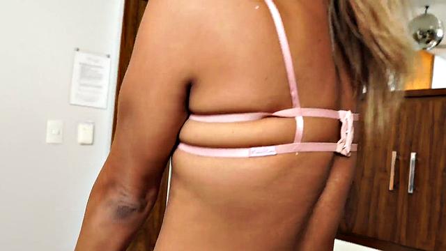 Watch this sexy babe tease her small tits and ass in high heels and lingerie