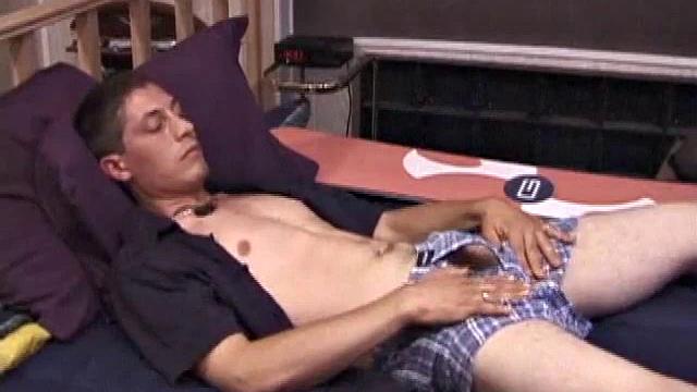 Dakota finds a spot in the porn movie that stimulates him. After stripping naked, Dakota strokes his cock and fingers his ass until he explodes all over his chest with a nice warm load.