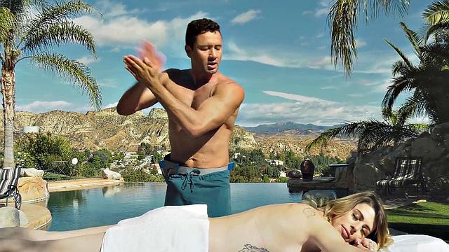 Tattooed shemale oils up and fucks masseur in public pool for a good handjob