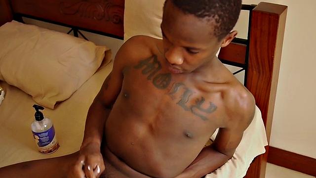 Slim African jerks his lubed uncut shaft in solo action