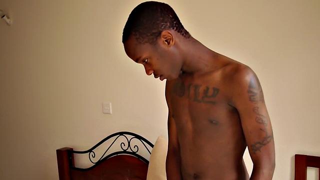 Slim African jerks his lubed uncut shaft in solo action