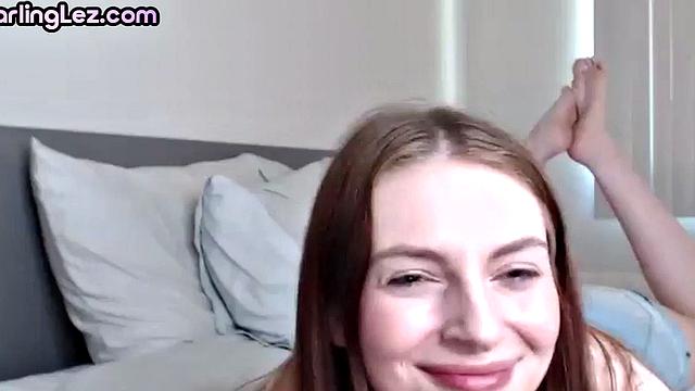 Lesbian babes playing with toy on video call and teasing