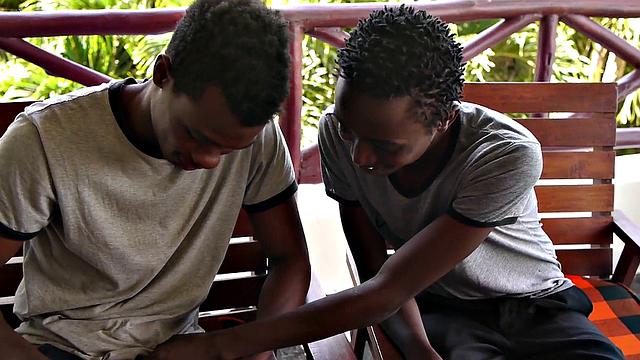 African twink blows partner's uncut dick before bareback sex