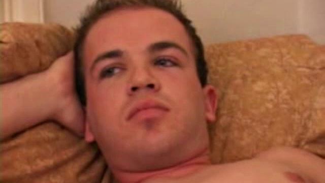 Austin Joseph lubes, strokes his cock, then shoves ribbed dildo up his ass for stimulation.