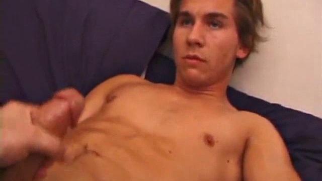 Sprawled out on the bed, Brock Labelli starts stroking. After the cameraman douses him with baby oil he continues to play with Brock's nipples, asshole, and cock.