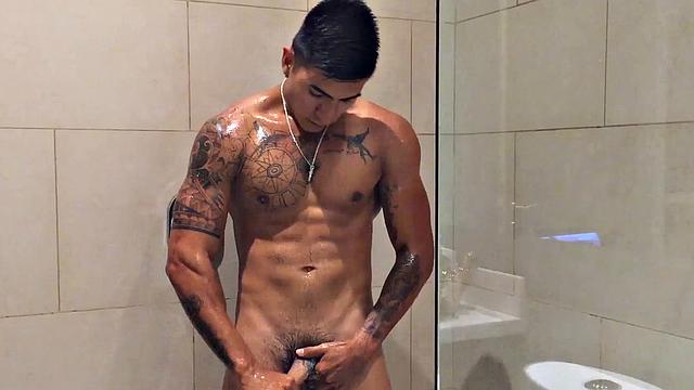 Our featured solo boy of the week is Erick, a muscular and inked young Latino who invites us to watch as he jerks off in the shower.