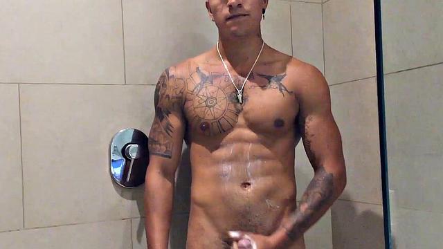 Our featured solo boy of the week is Erick, a muscular and inked young Latino who invites us to watch as he jerks off in the shower.