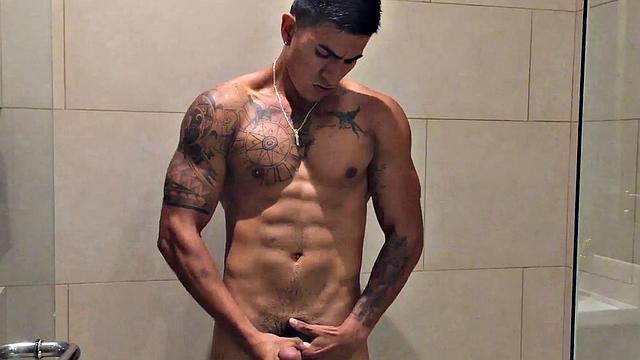 Our featured solo boy of the week is Erick, a muscular and inked young Latino who invites us to watch as he jerks off in the shower.