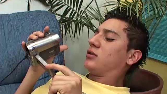 Fausto and Tomas are on the sofa exploring each other's bodies with a hand-held camera. Pants come down and lips wrap around big uncut cock, as they capture lots of close-ups of their fun.