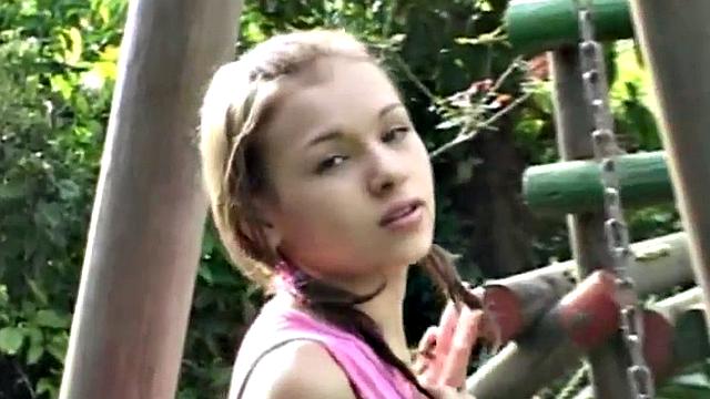 Cute teen plays with cunt in outdoor scene