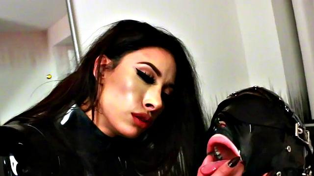 Submissive latex TS strapon fucked by femdom babe
