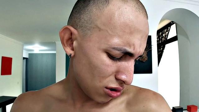 Slim and smooth Tenoch quickly strips naked and works up a stiff one. Standing, he starts beating off, while fingering for added stimulation.