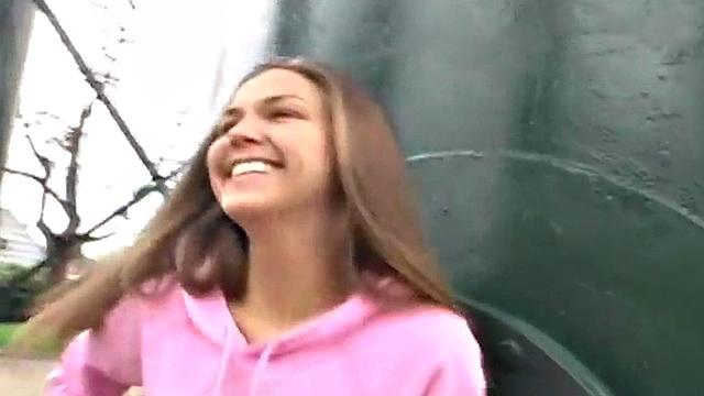 Sweet teen posing and showing her breasts in the open