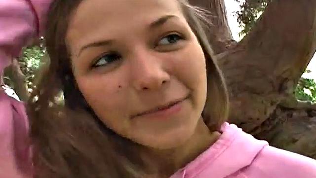 Sweet teen posing and showing her breasts in the open