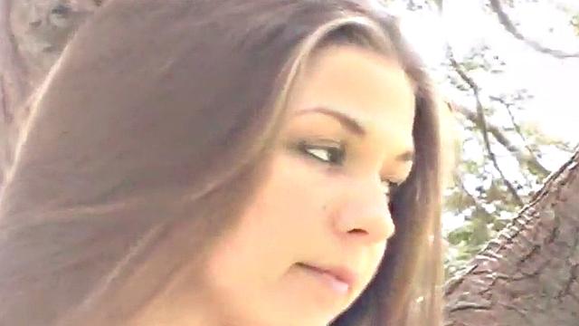 Sweet teen posing and showing her breasts in the open