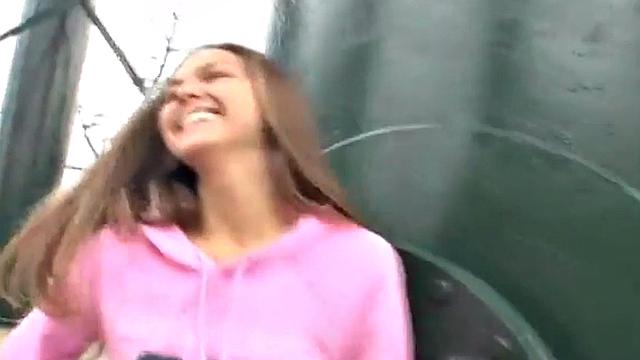 Sweet teen posing and showing her breasts in the open