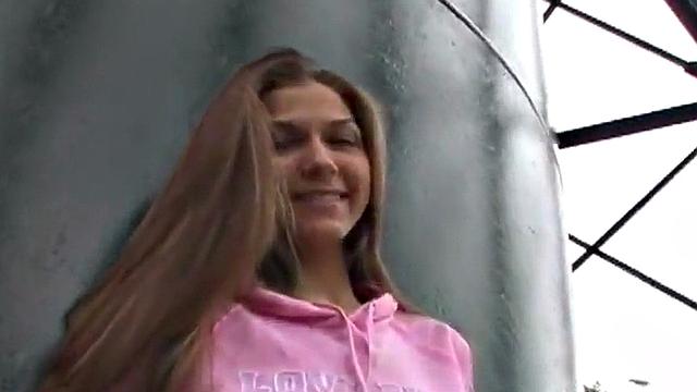 Sweet teen posing and showing her breasts in the open