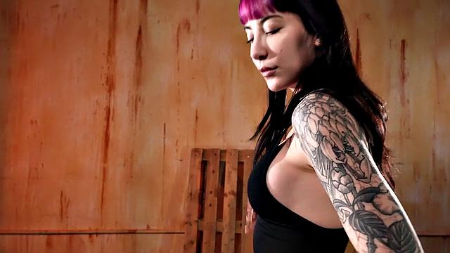 Colored hair tattooed babe masturbates with fuck machine