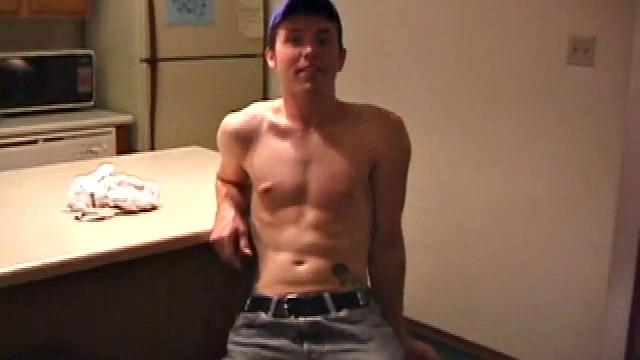 Christian Dane strips down to his underwear. When they are eventually removed we see this skinny little boy has a great big dick. He moves from sofa to the bed, all the while fingering his ass and balls while steadily stroking.