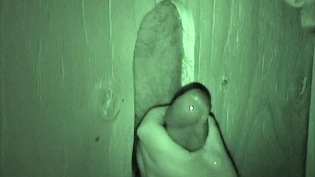 Mitch is at the glory hole and we watch as Auntie Bob pulls his dick out of his pants and goes down on it. The mature man lics and sucks Mitch's cock until there's no holding back.