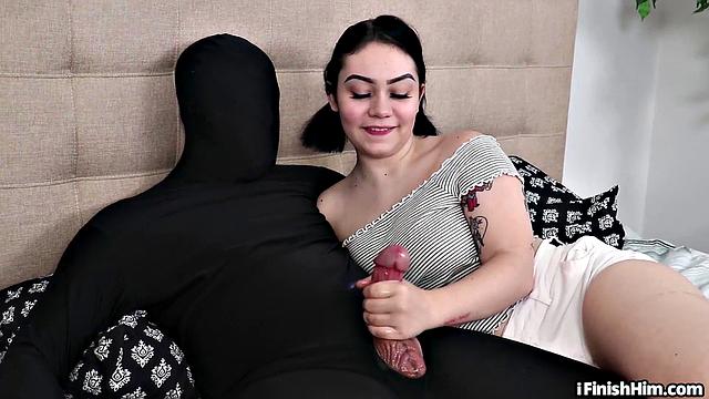 Watch as tattooed babe gives a kinky handjob to her client while wanking his midget dick in the living room