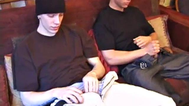 Shane and Brock sit side-by-side and begin watching their porn, while getting themselves ready for their task. Soon hands find their way into their pants. Cock in hand, Brock strokes and soon both he and Shane are stripping naked.