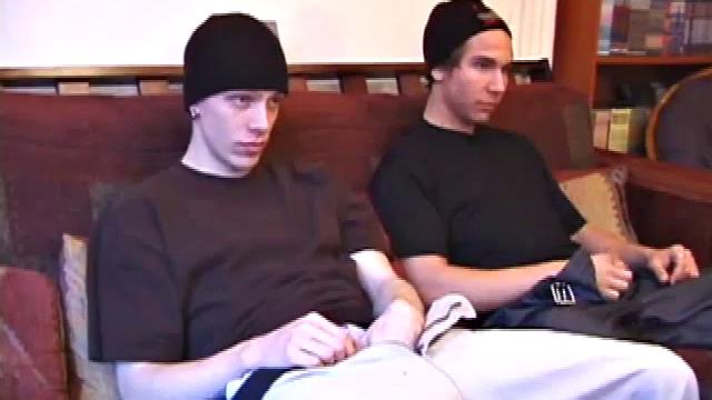 Shane and Brock sit side-by-side and begin watching their porn, while getting themselves ready for their task. Soon hands find their way into their pants. Cock in hand, Brock strokes and soon both he and Shane are stripping naked.