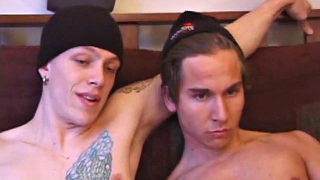 Shane and Brock sit side-by-side and begin watching their porn, while getting themselves ready for their task. Soon hands find their way into their pants. Cock in hand, Brock strokes and soon both he and Shane are stripping naked.
