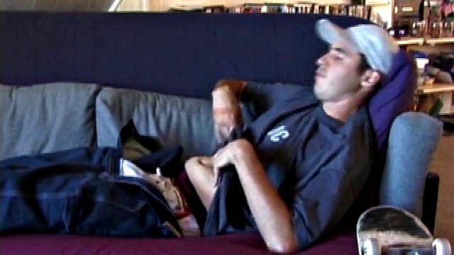 This 21 year old skater boy reclines on a sofa and rubs himself through his jeans. Getting harder, Mark shows off his nice boner while staring into the camera.