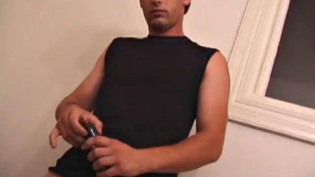 Kalvin is up and ready to go in his sleeveless muscle shirt, and nothing else. He works his dick, both on the bed and standing against a wall. This young man manipulates his meat, with both hands, tugging on his nut sack as he strokes.