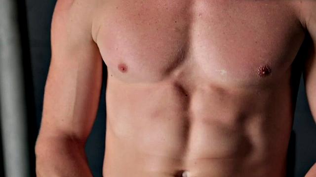 Amateur stud teases before jerking by the fireplace