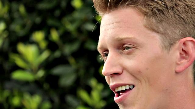 Amateur stud teases before jerking by the fireplace