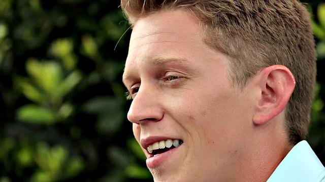 Amateur stud teases before jerking by the fireplace