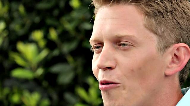 Amateur stud teases before jerking by the fireplace