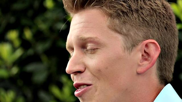 Amateur stud teases before jerking by the fireplace