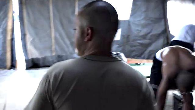 Watch these soldiers go wild in a wild outdoor interracial orgy with a submissive wearing glasses and a black tank top