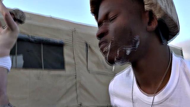 Watch these soldiers go wild in a wild outdoor interracial orgy with a submissive wearing glasses and a black tank top