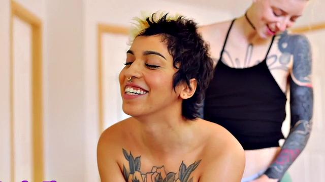 Strapon wearing inked queer fucks inked GF in pussy