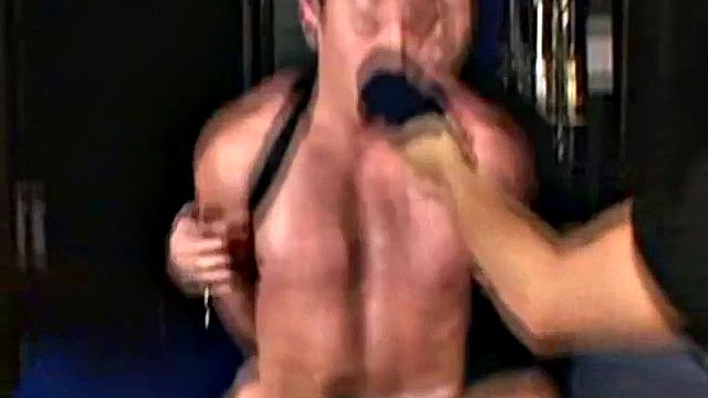 Scott strokes his thick cock and moans while watching gay porn