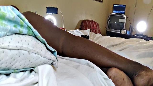 A hot American MILF masturbate in the bedroom with her bald pussy