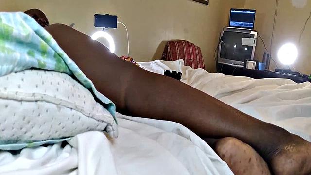 A hot American MILF masturbate in the bedroom with her bald pussy