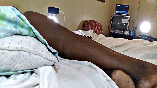 A hot American MILF masturbate in the bedroom with her bald pussy