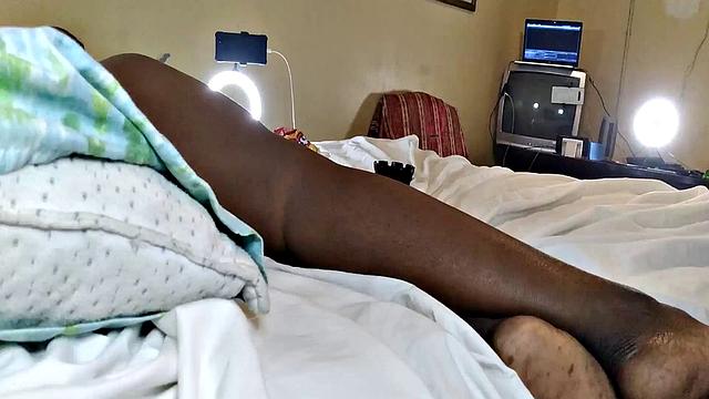 A hot American MILF masturbate in the bedroom with her bald pussy