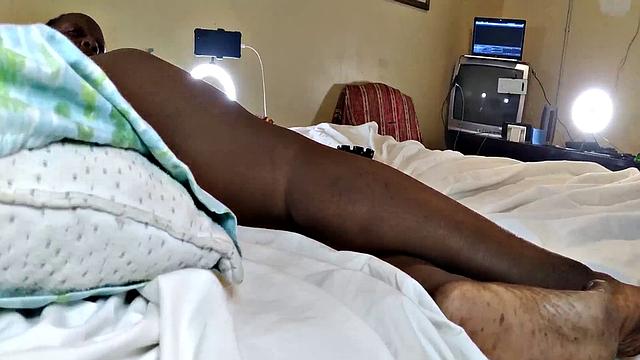 A hot American MILF masturbate in the bedroom with her bald pussy