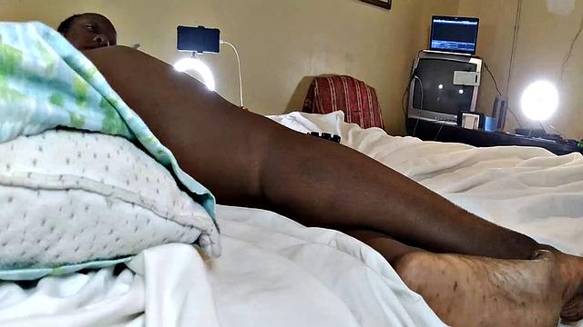 A hot American MILF masturbate in the bedroom with her bald pussy