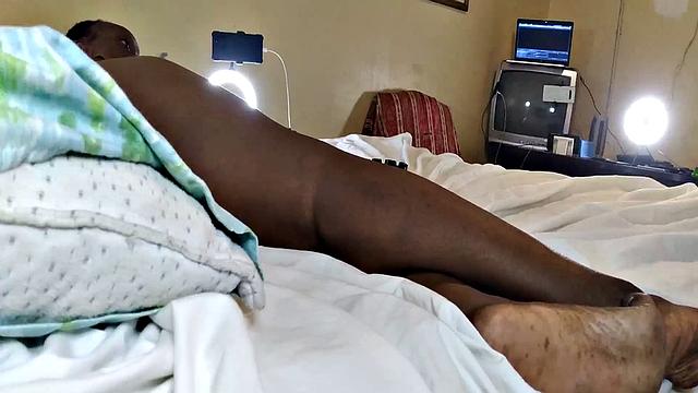 A hot American MILF masturbate in the bedroom with her bald pussy